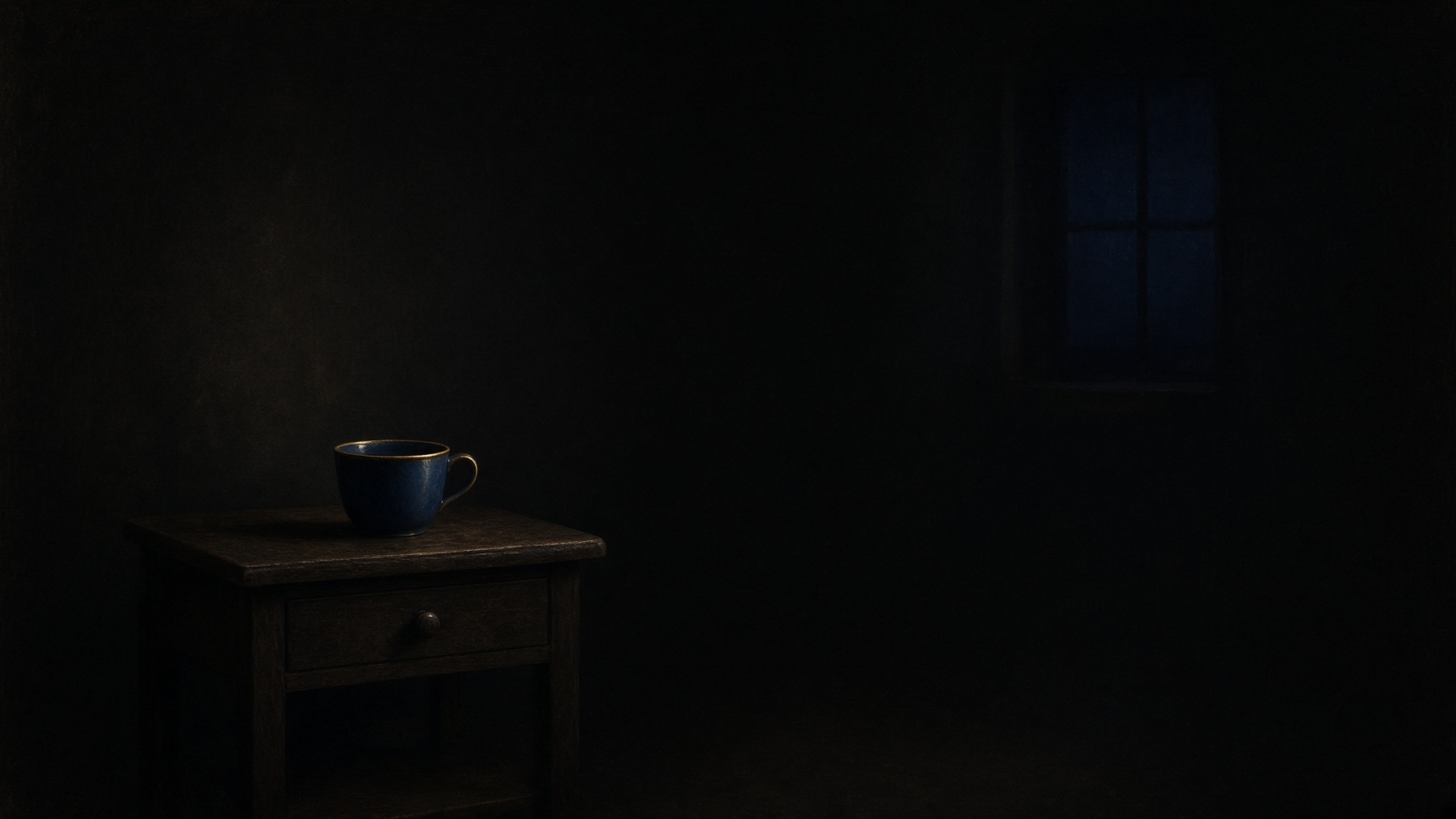 One cup on a night table. Almost nothing else.