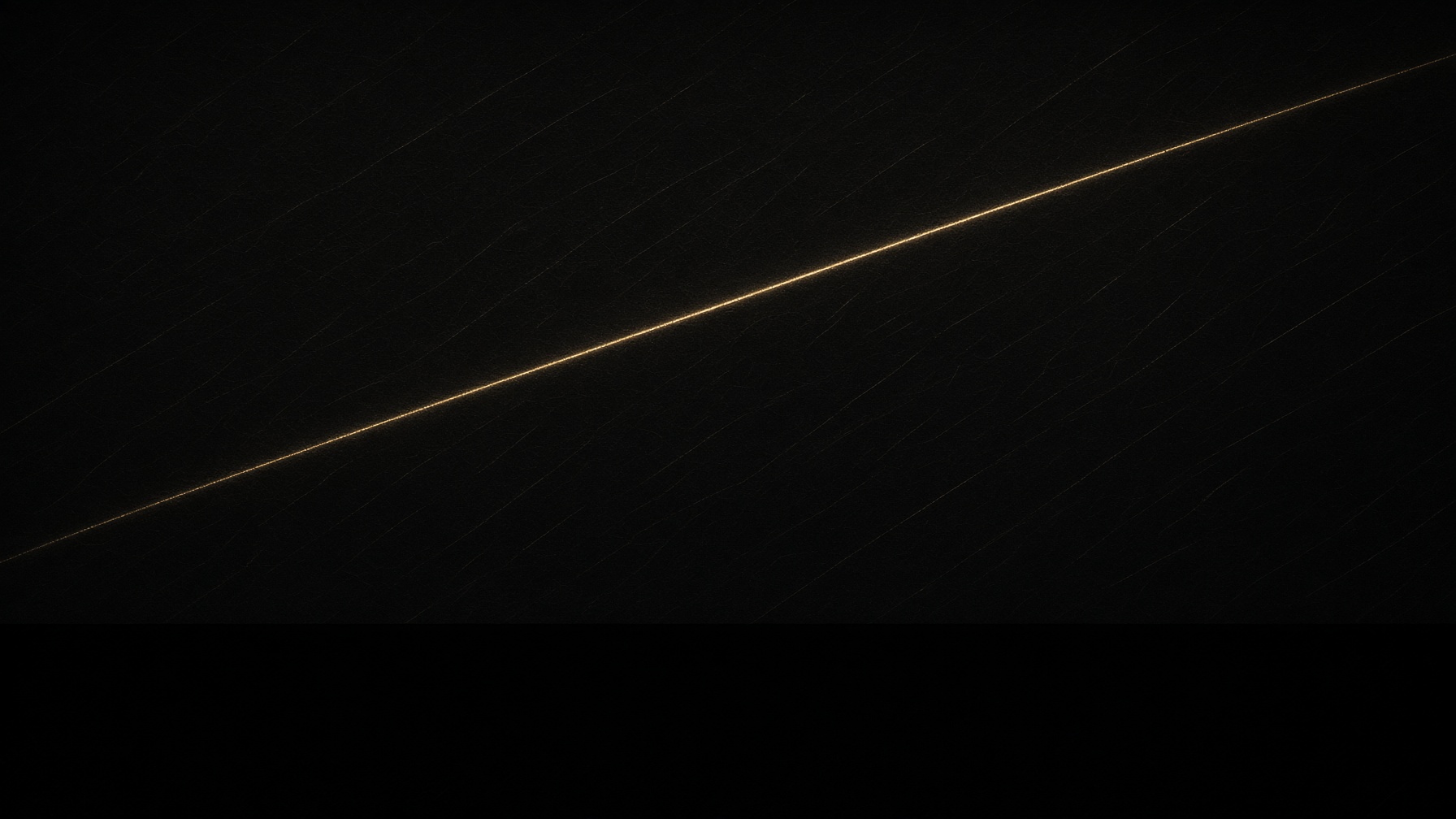 One unexpected gold filament crossing a quieter field.